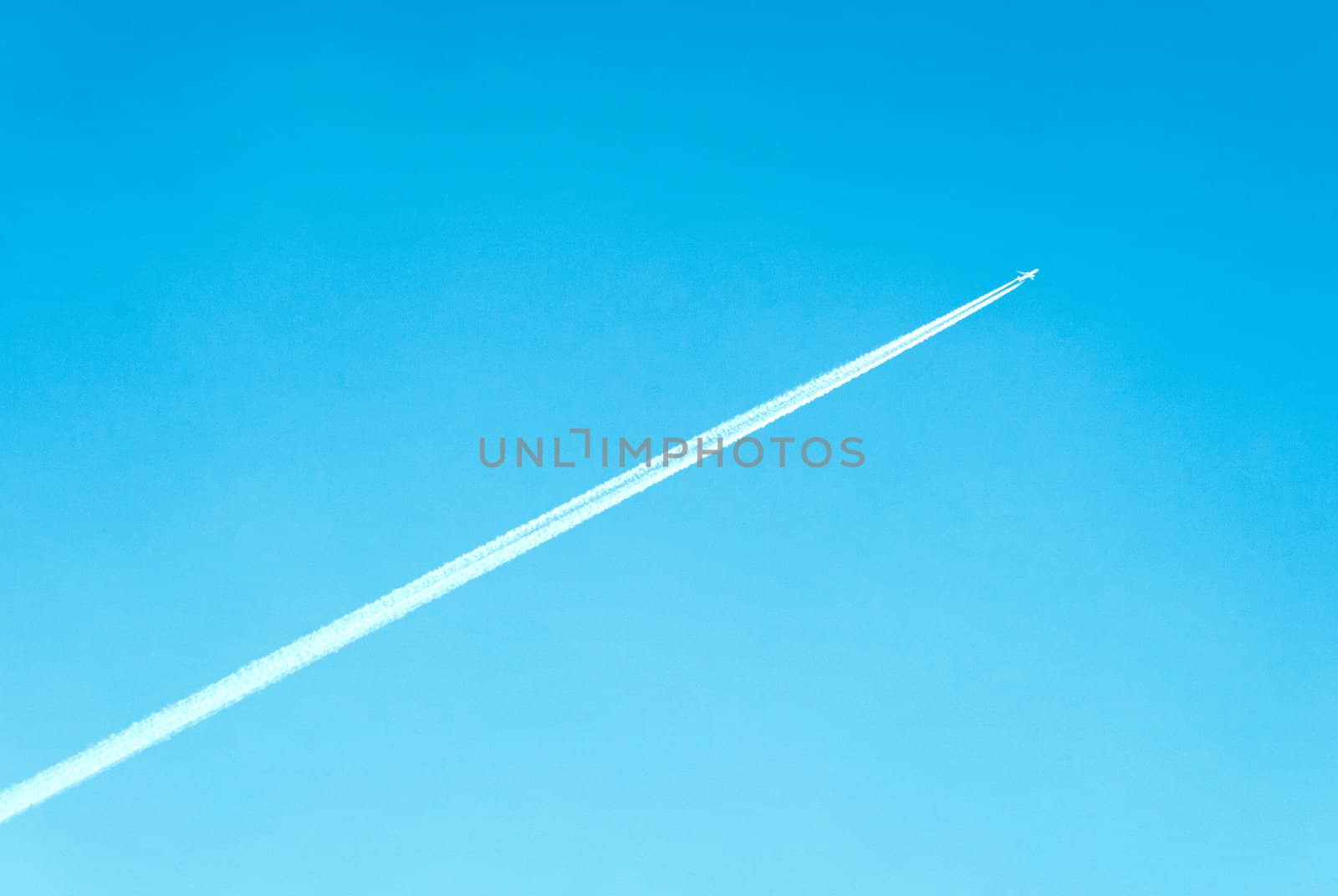 airplane in the blue sky by DNKSTUDIO