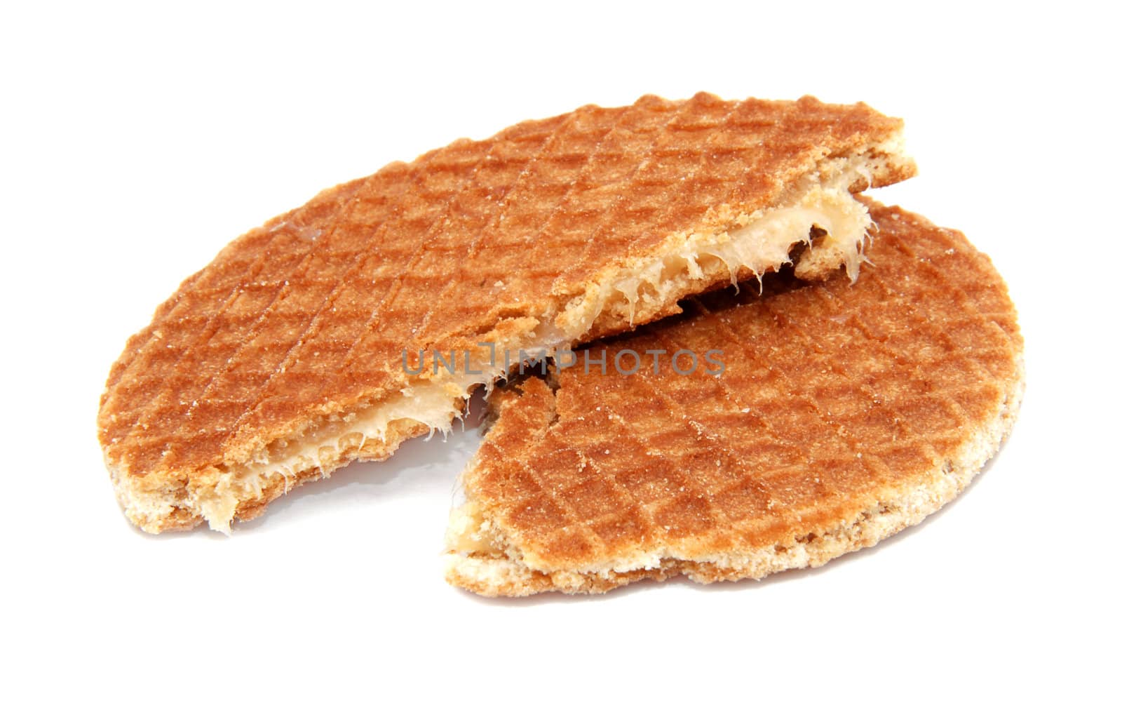 Stroopwafel, Dutch caramel waffle broken in half, isolated on a white background