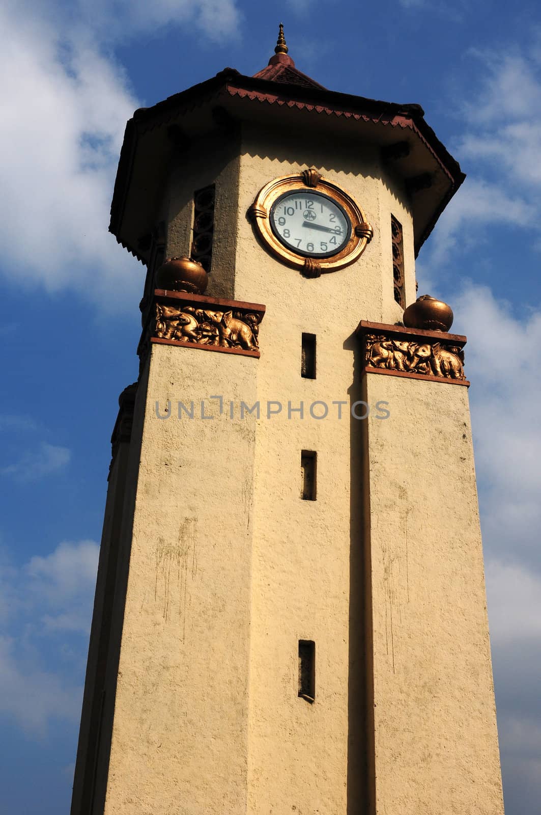 Historic bell tower in Sri Lanka against blue sky