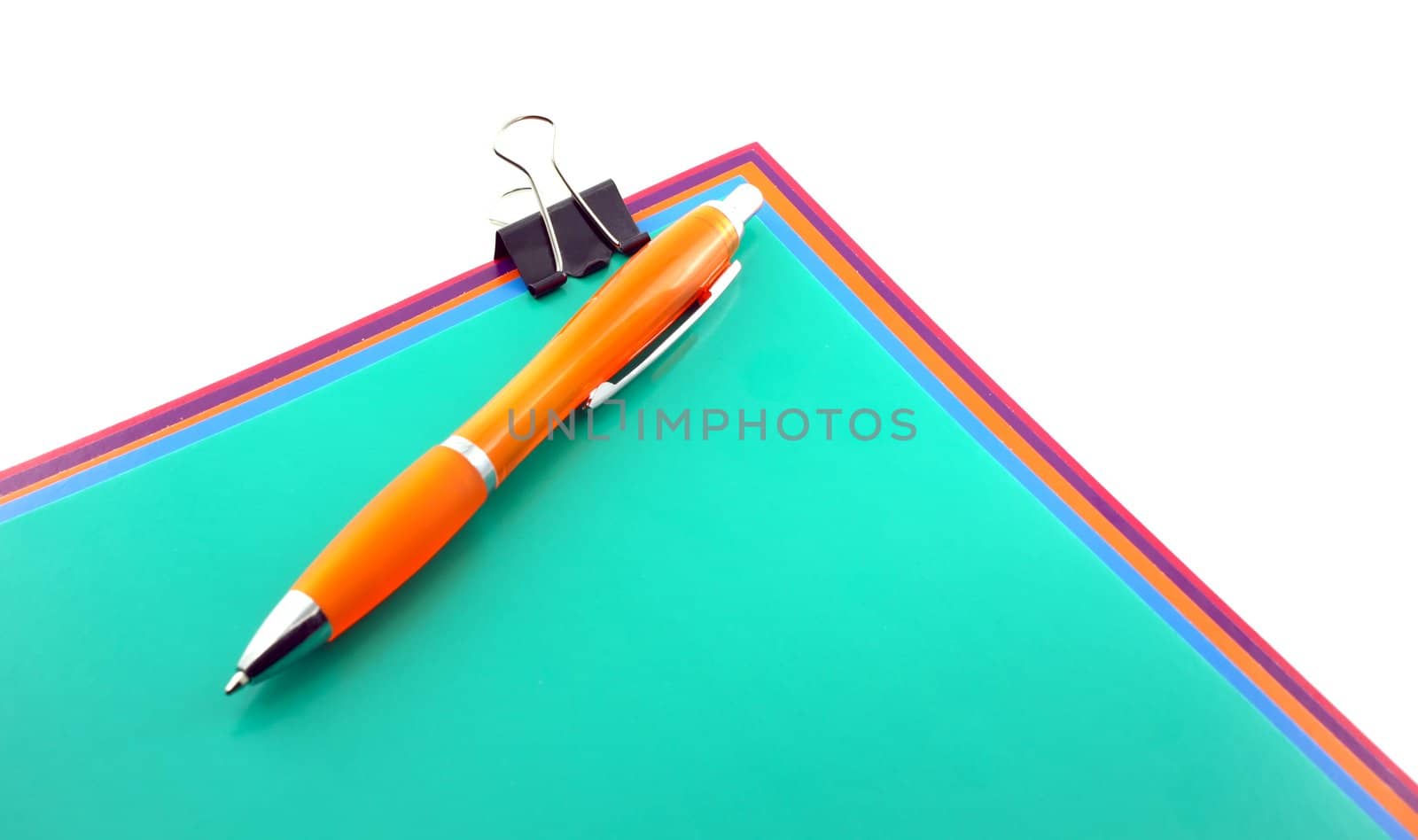 Color papers, black clip and orange pen.