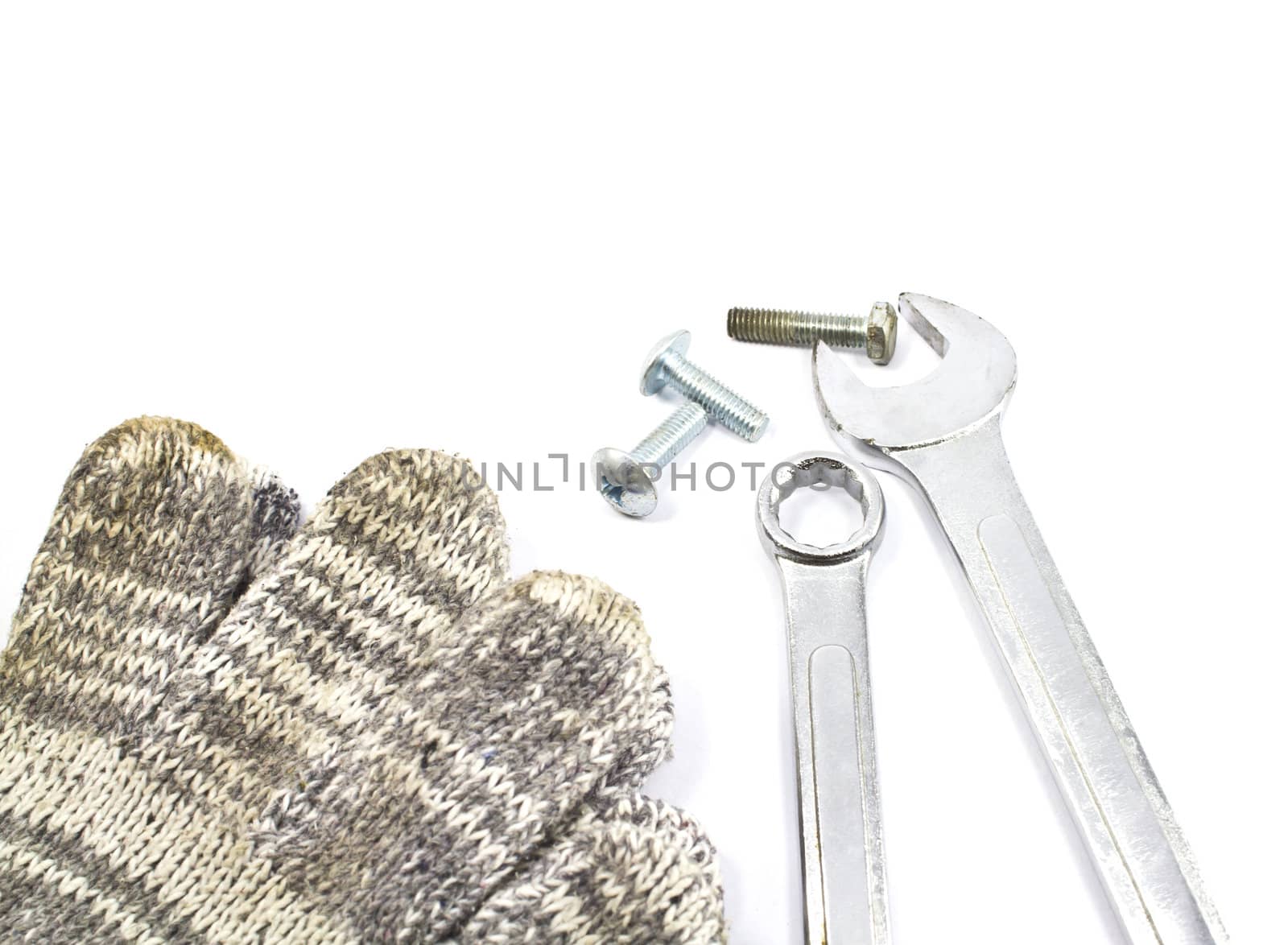 Chrome Vanadium spanner or wrench with new and old nuts and bolts.