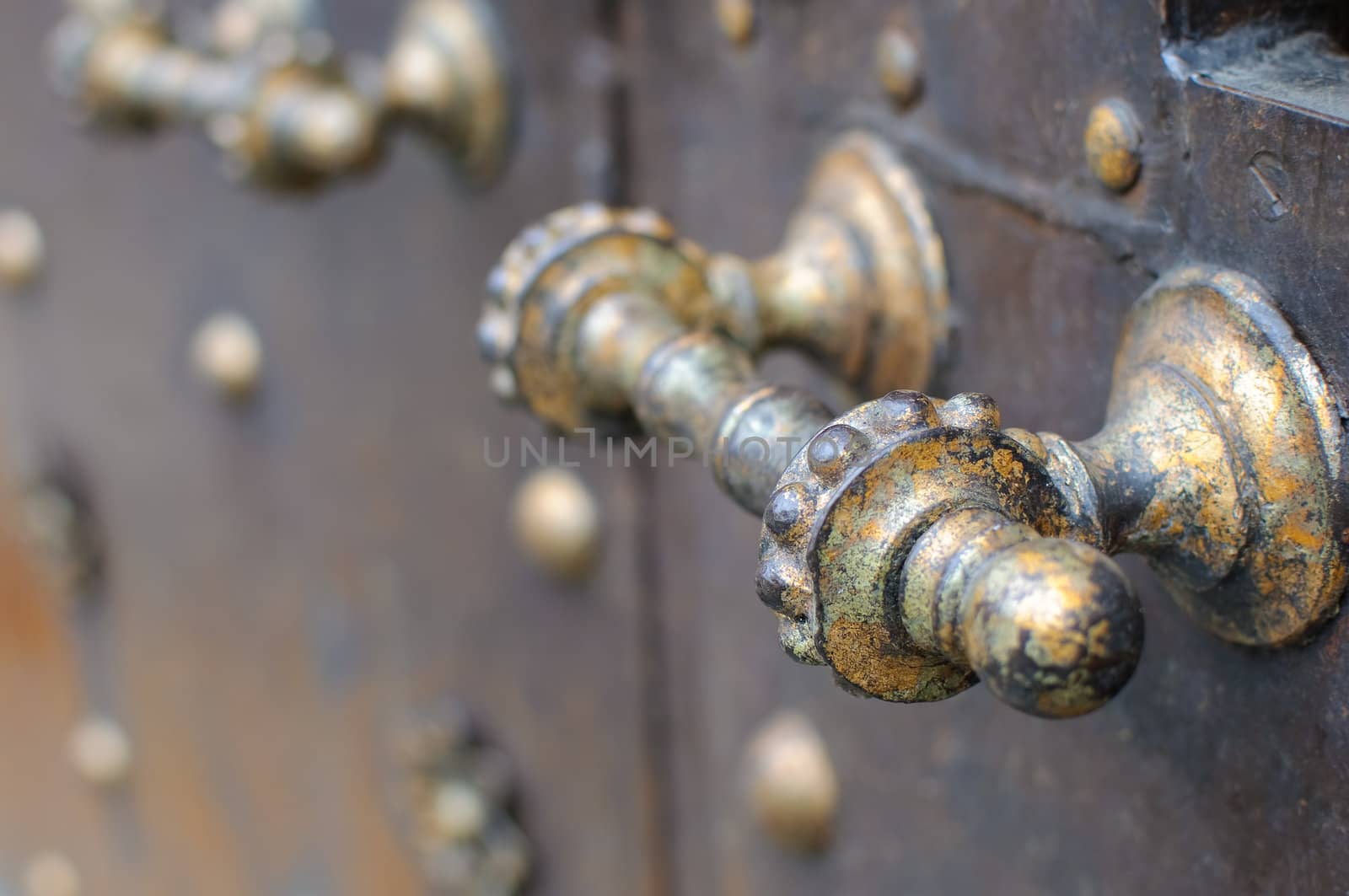 A rustic metal doorhandle.