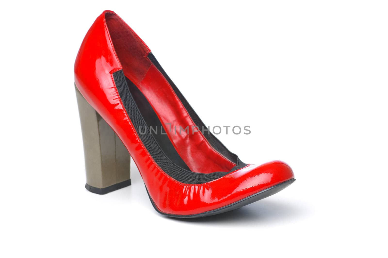 A single red womans shoe on white isolated background.