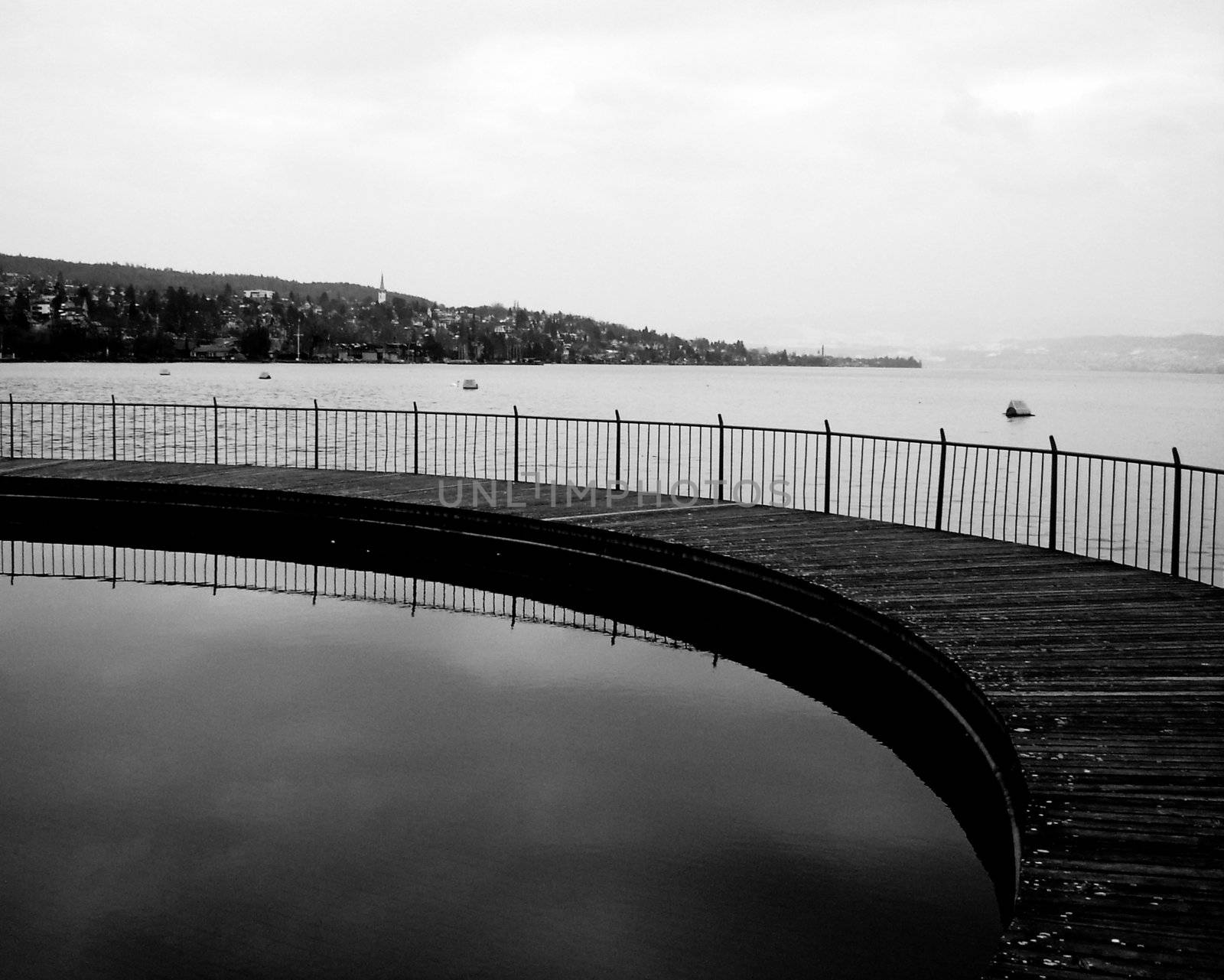 Lake Pier. Black and white. Reflexion.