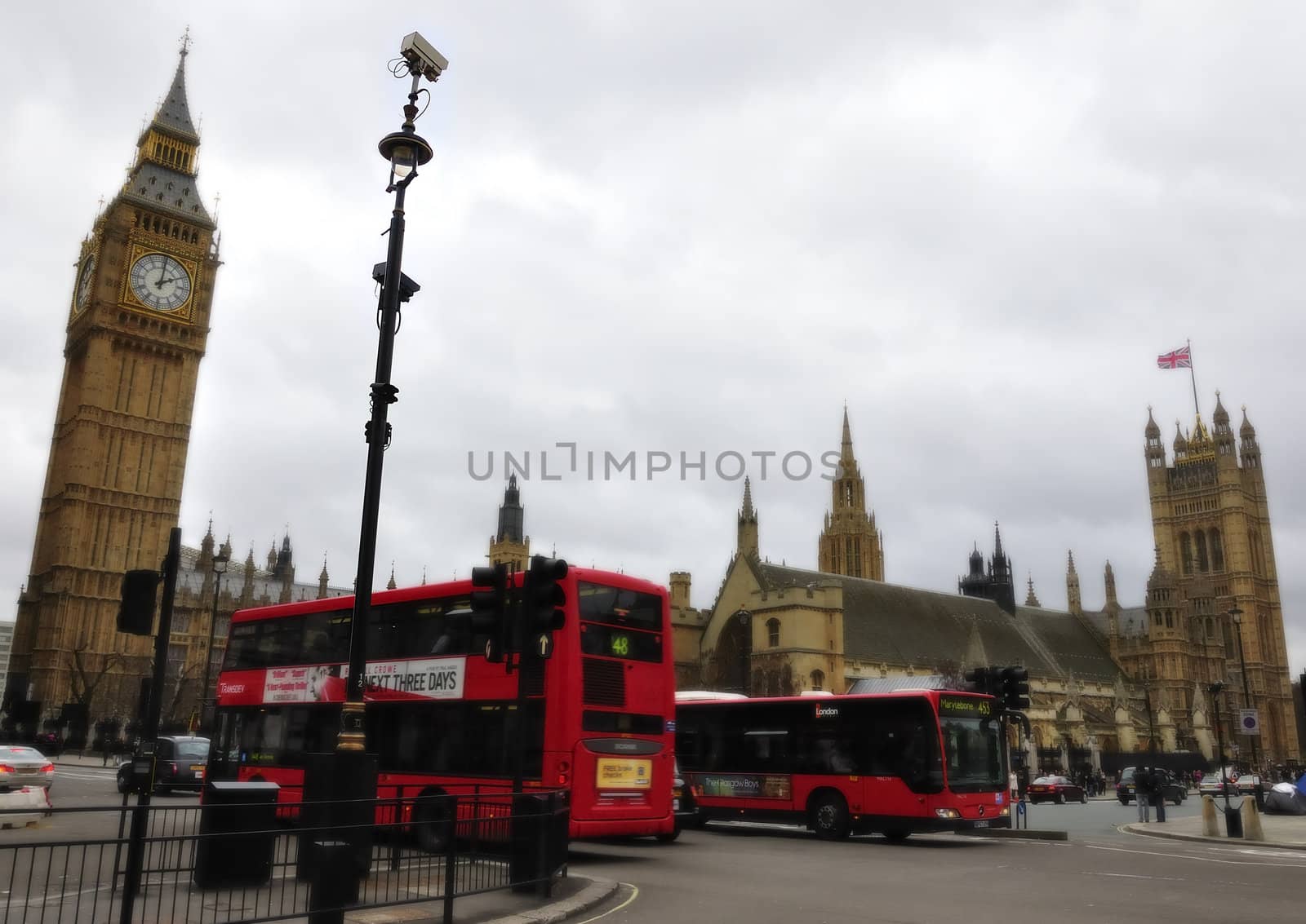 UK parliament, full view. With people and the classic red bus.