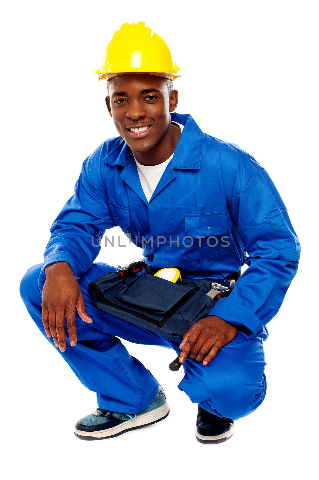 Seated african worker posing with a smile isolated over white background
