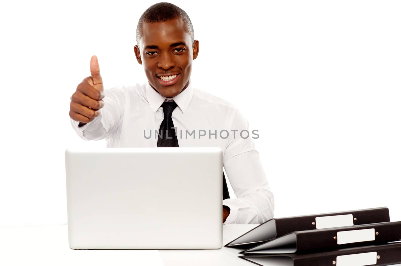 Happy young african gesturing thumbs up at camera