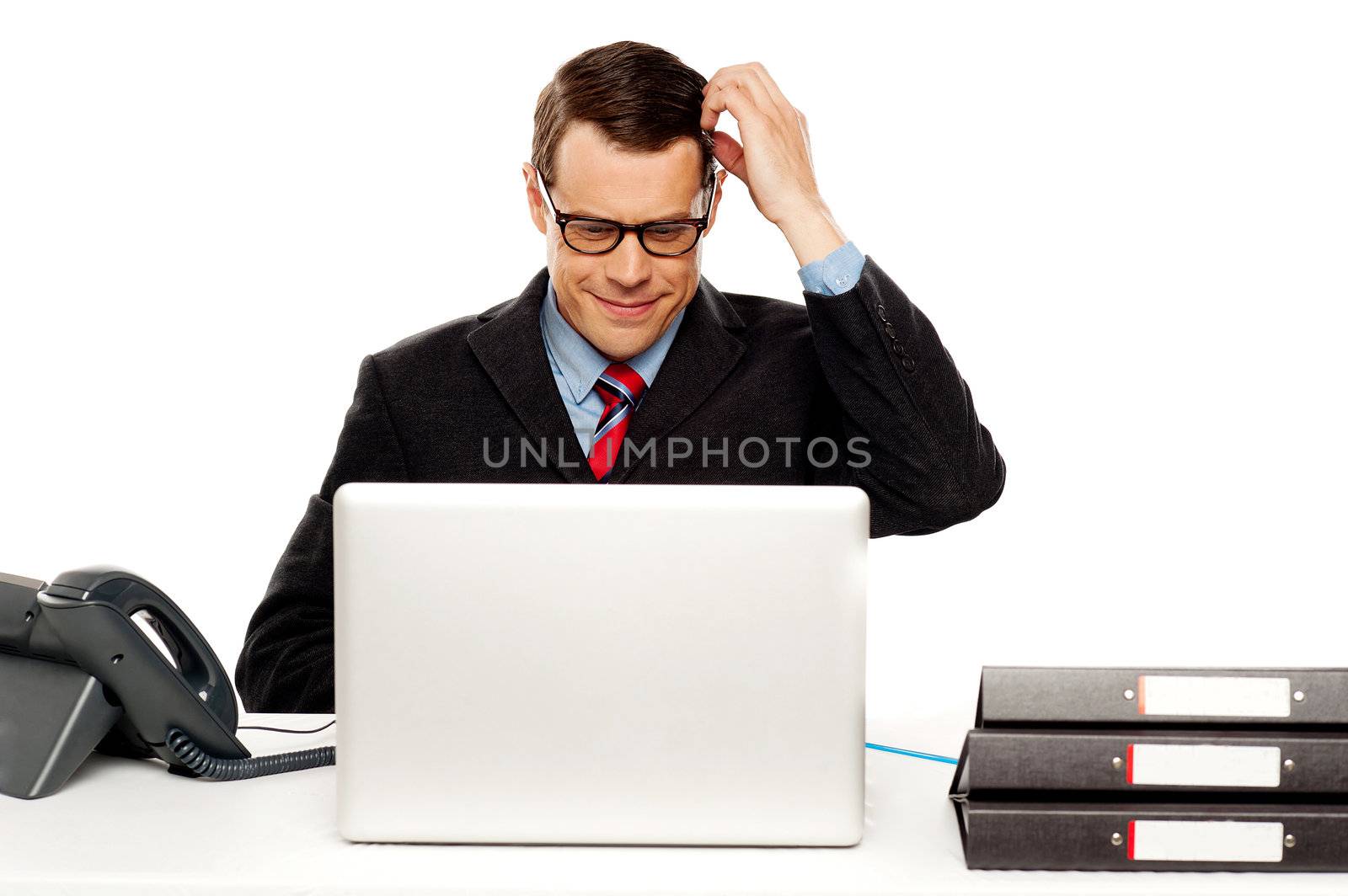 Confused male manager itching his head. Trying to understand business module