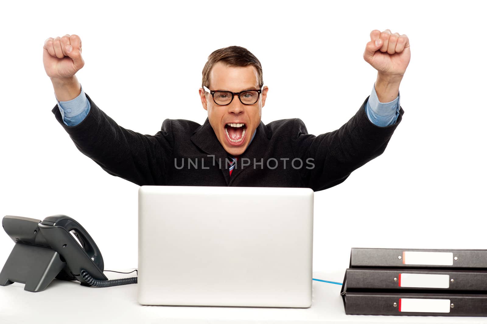 Excited businessman shouting and rejoicing his victory. Wearing glasses and arms raised up