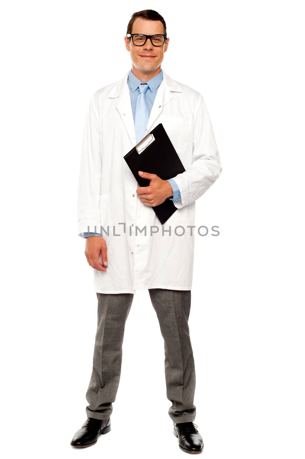 Full length shot of male doctor posing with clipboard over white