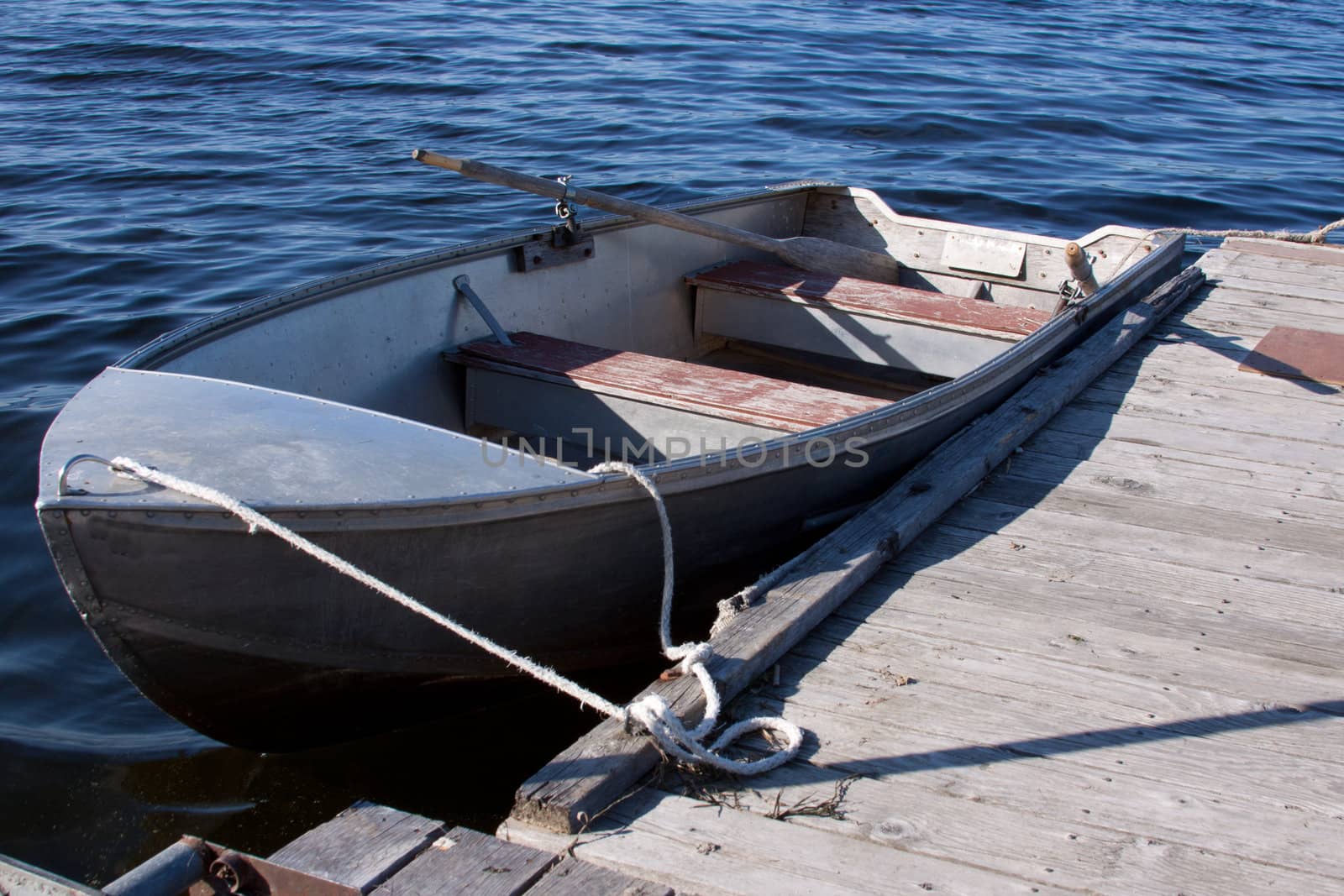 Boat tied to a dock.