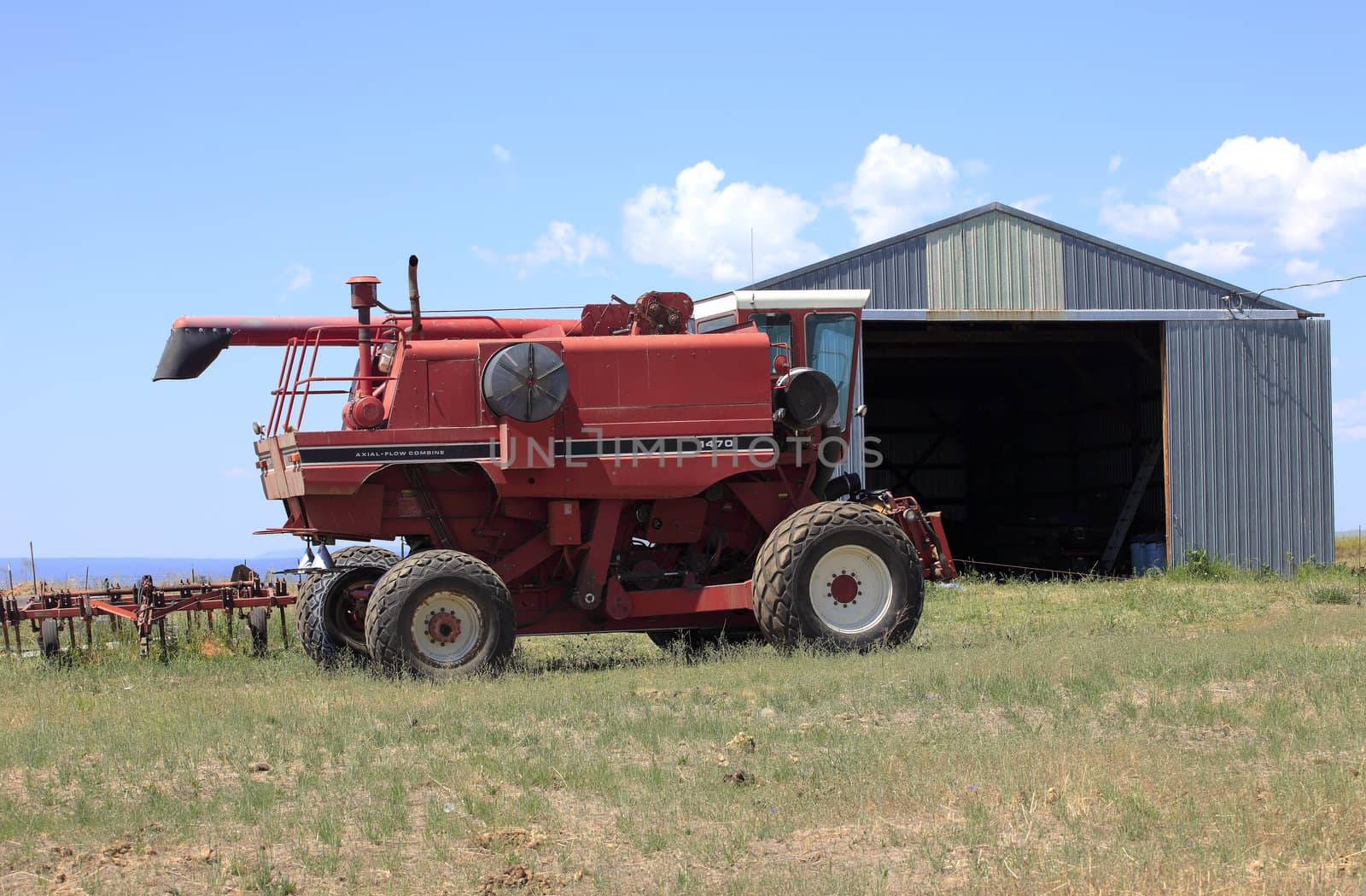 Farm machinery and metal shed in rural Washington state.