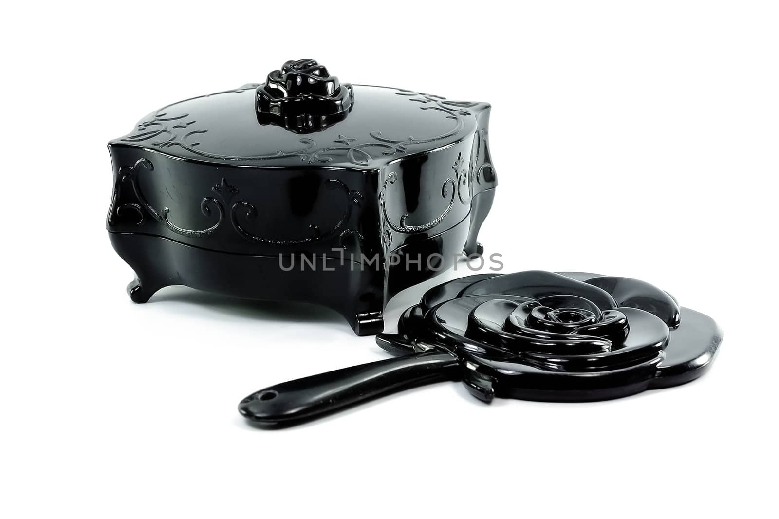 Black antique old box close with black mirror shape of rose isolate on white background