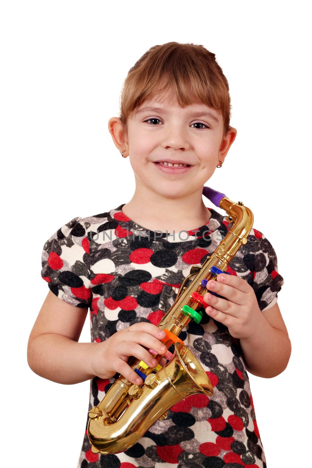 happy little girl with saxophone posing by goce