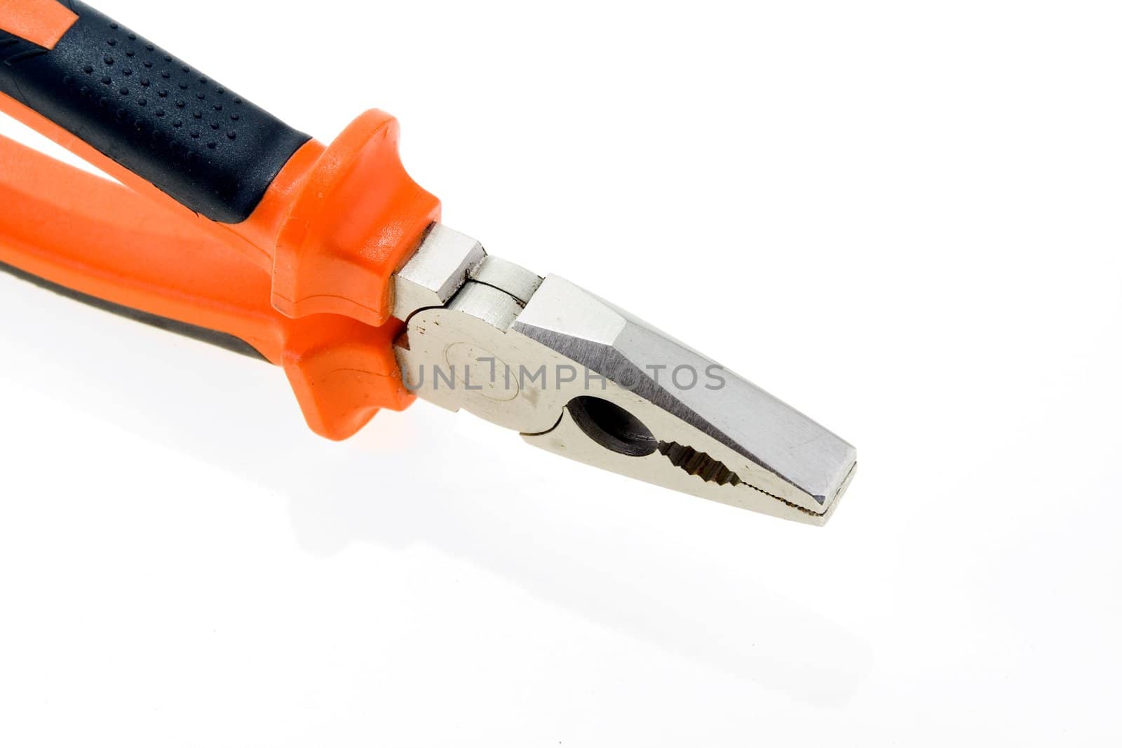 Steel used pliers with plastic color handles on a white background