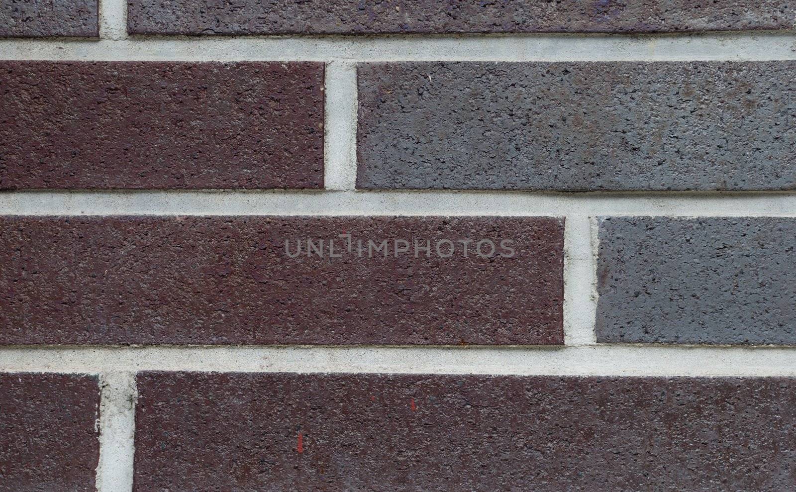 Close up of purple brick wall by Shane9