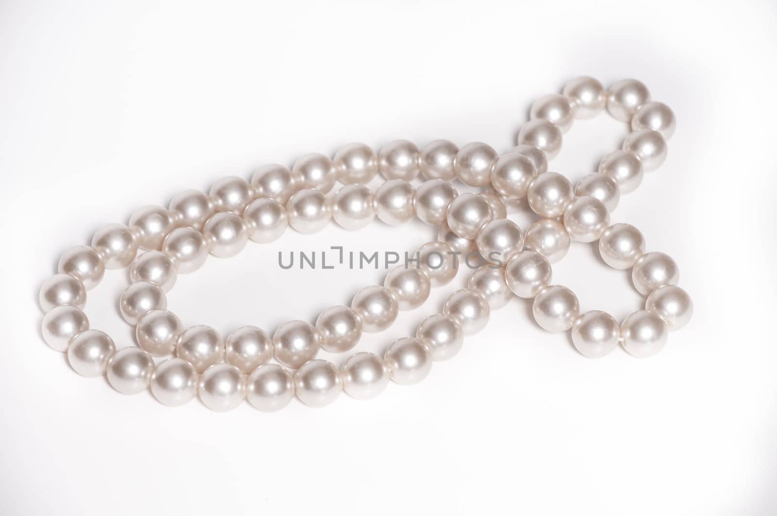 Close up of pearl necklace on isolated white background