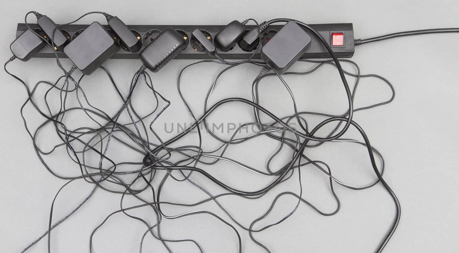 multiple socket with many power supplies in grey background