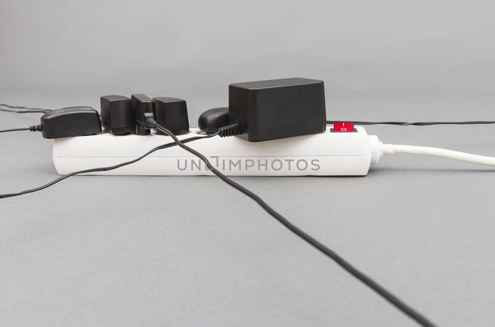 multiple socket with many power supplies in grey background