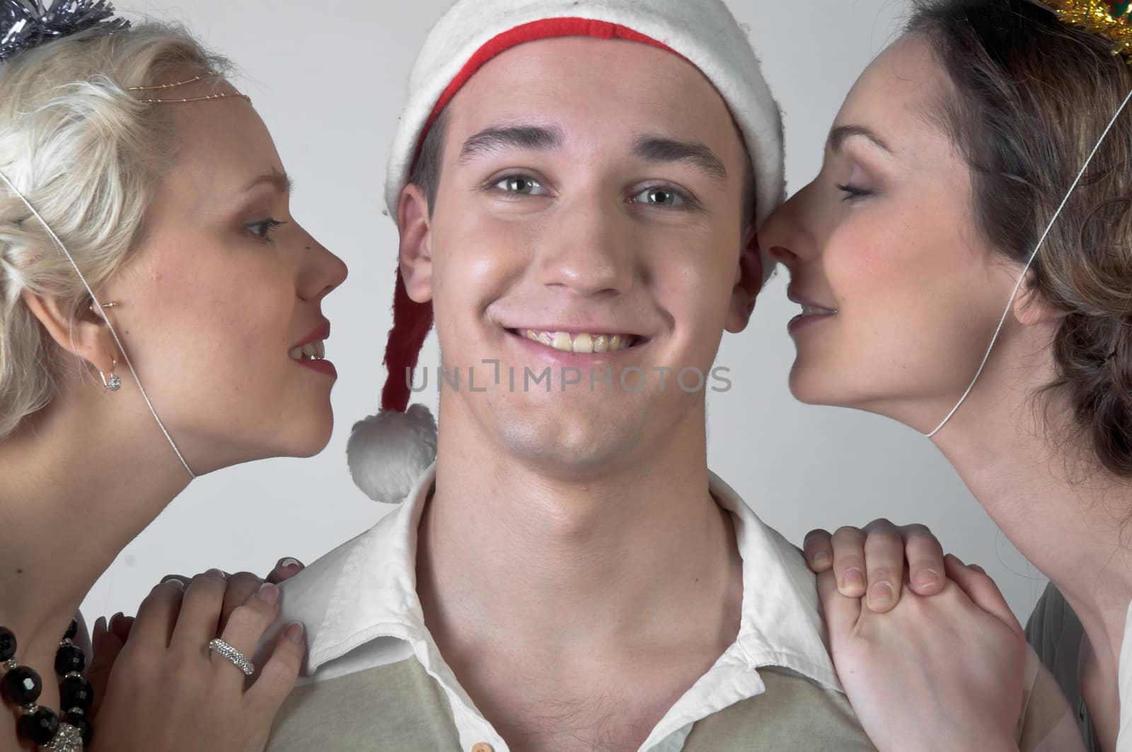 The company of young, beautiful and successful people preparing to celebrate Christmas