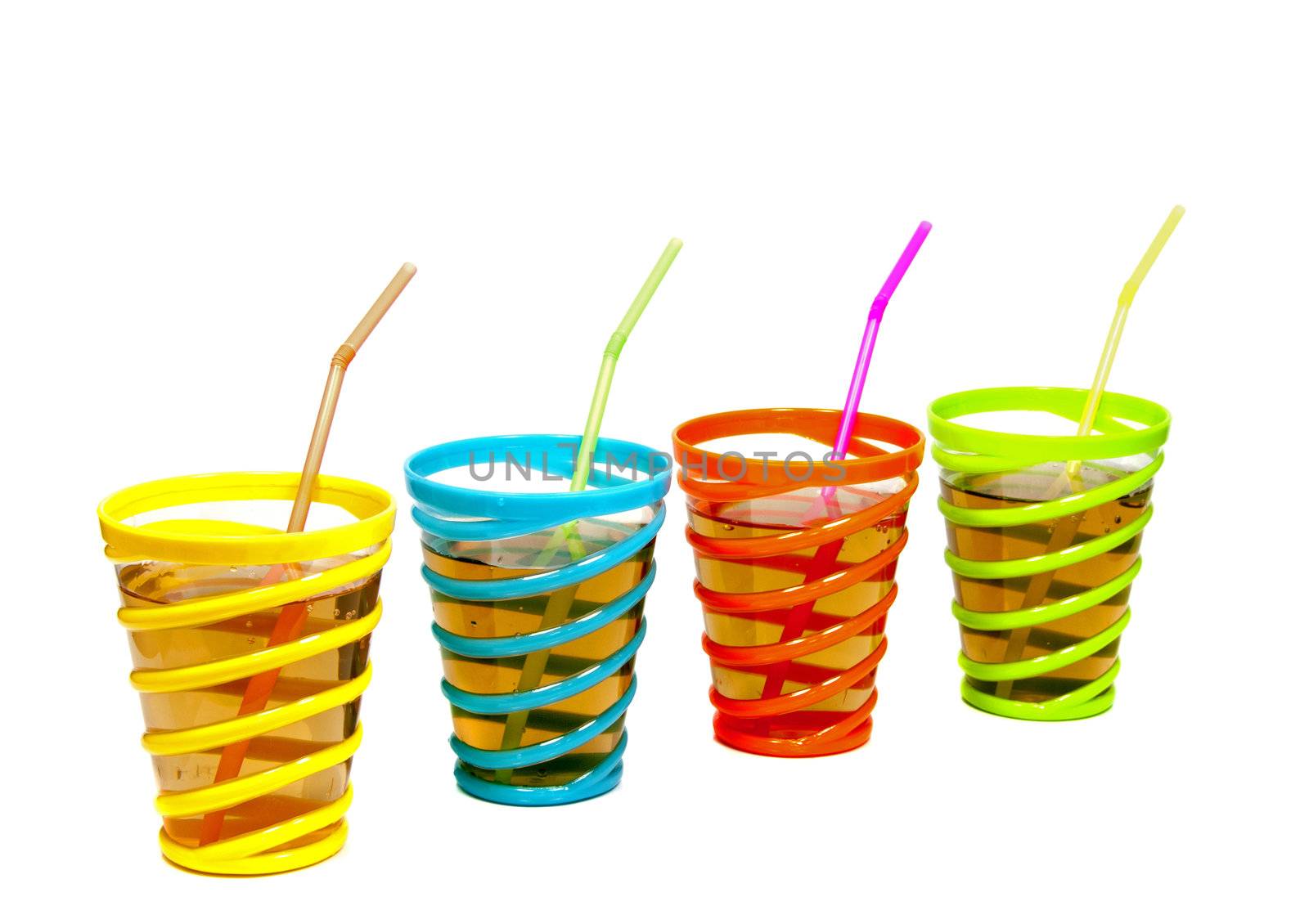drinks in glasses with red yellow green and blue color with straw