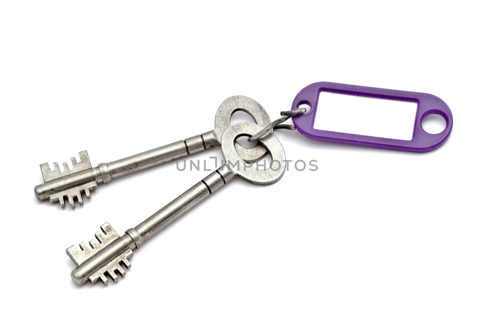 Key with a success tag closeup on white background