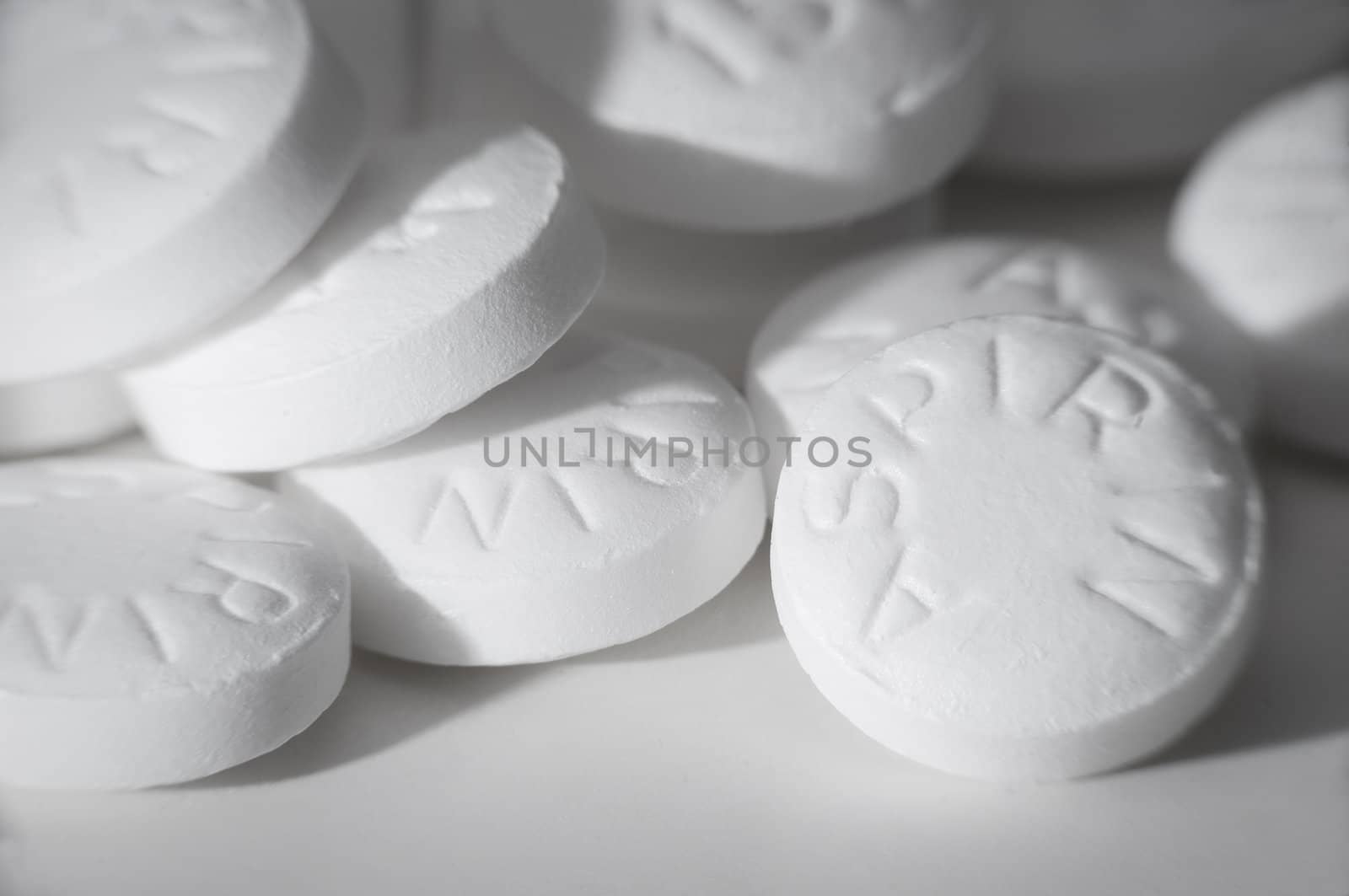 Macro shot of white asprin on white. by Shane9