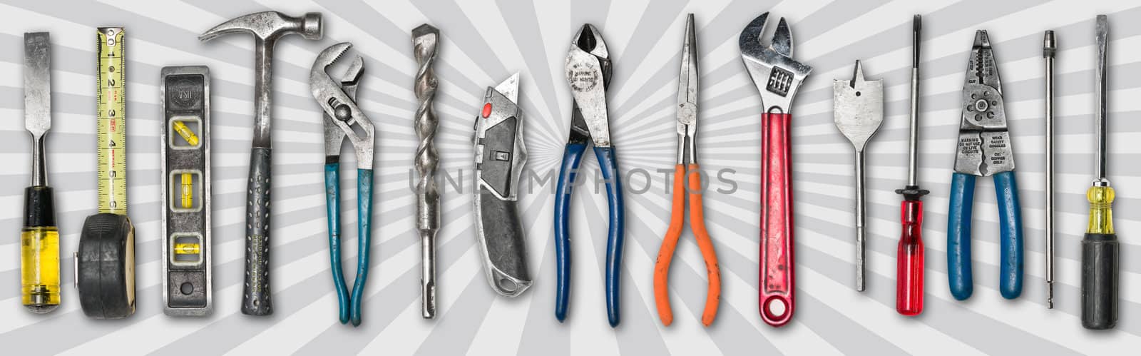 Various used tools on background with star burst