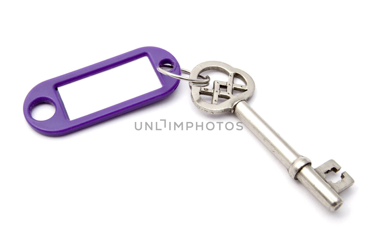 Blank tag and old key isolated on white background 
