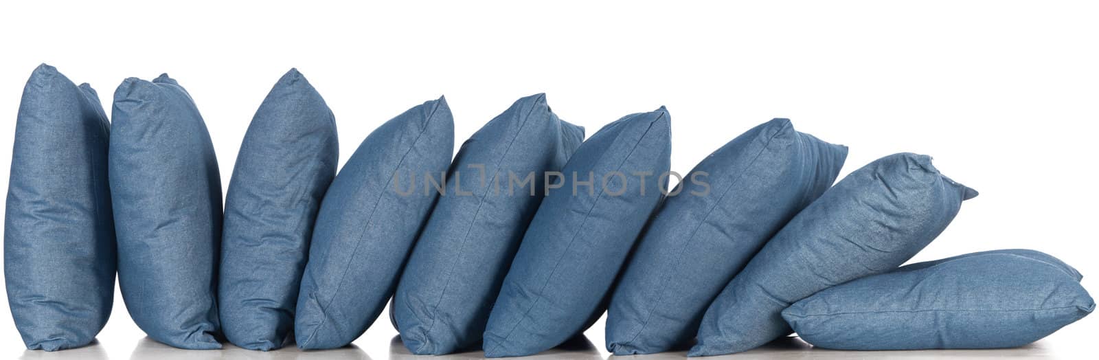 in a row blue denim pillows isolated on white