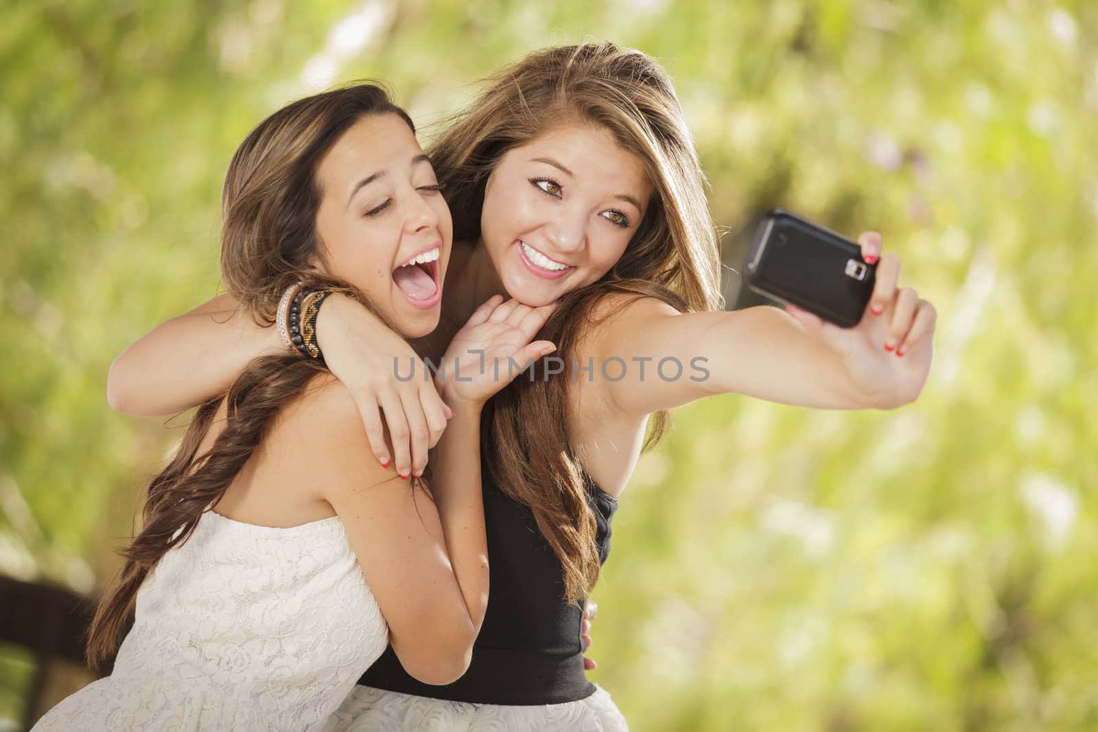 Attractive Mixed Race Girlfriends Taking Self Portrait with Came by Feverpitched