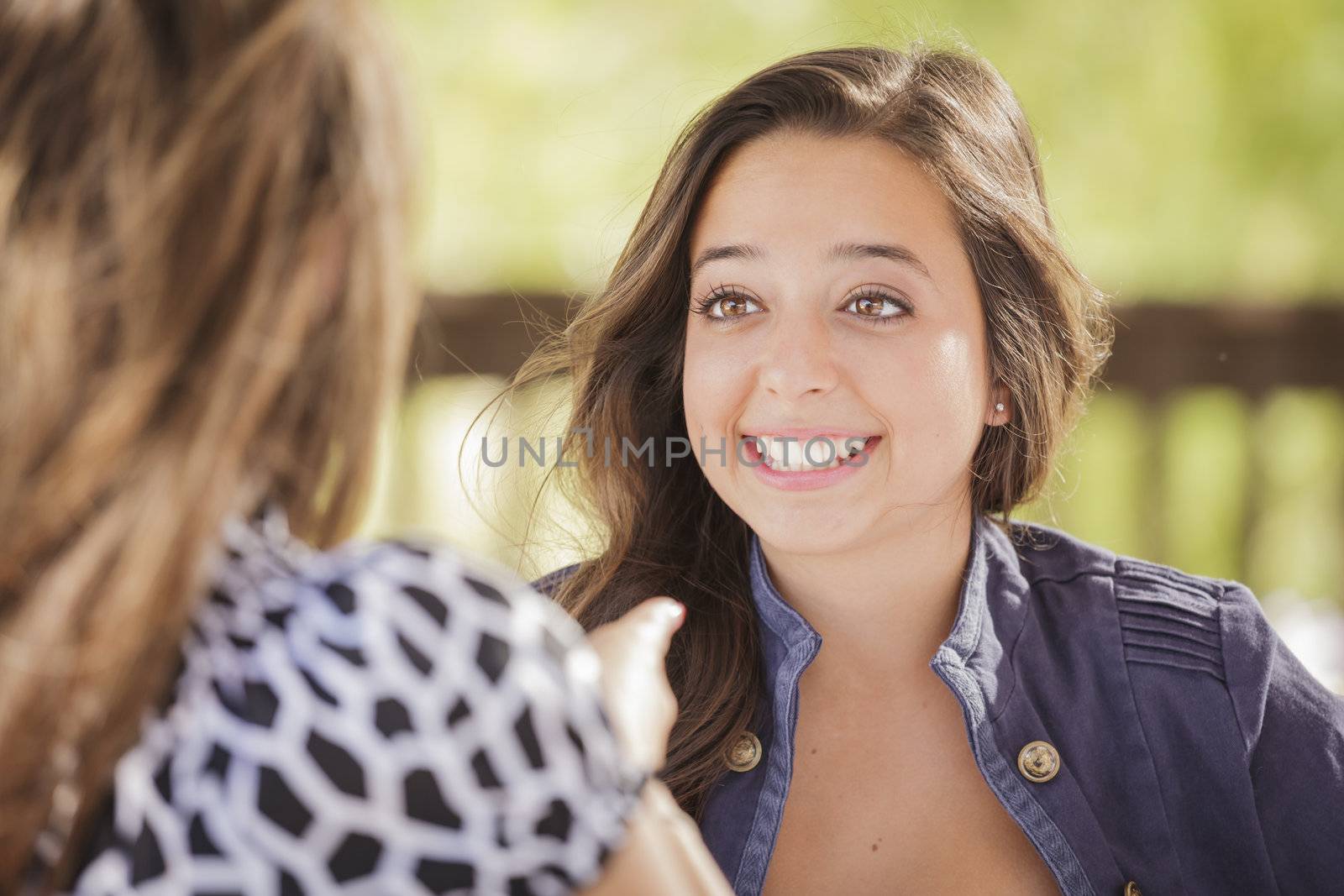 Attractive Girlfriends Laughing Sitting Outside by Feverpitched