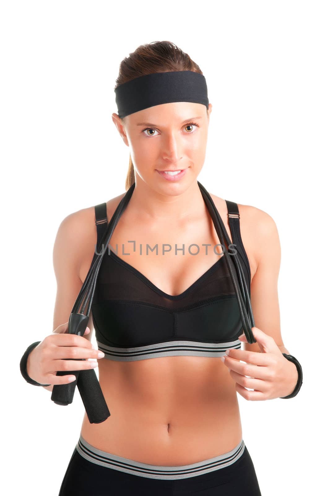 Woman with a jumping rope by her shoulders, about to start working out, isolated on a white background