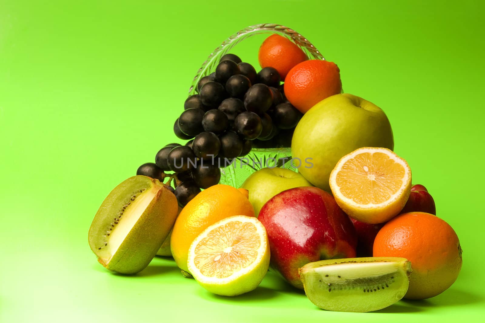 great number of bright and juicy fruit on a green background