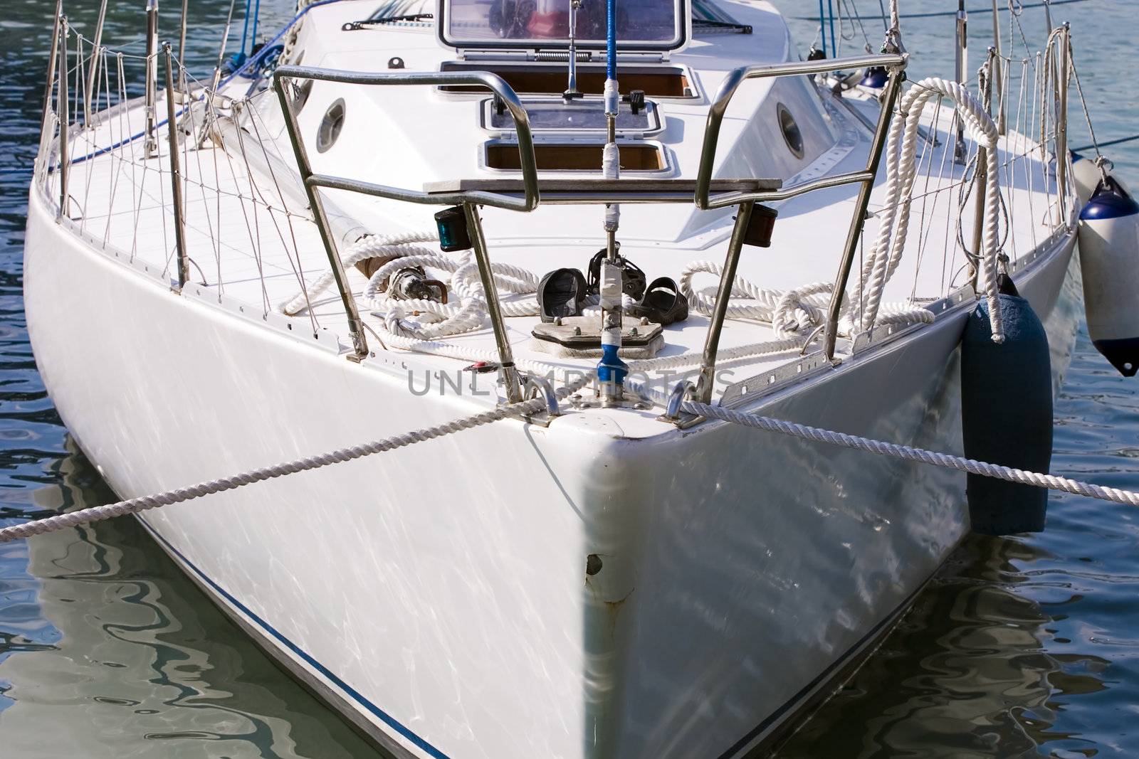 prow of ship white color, loosened on turquoise waves