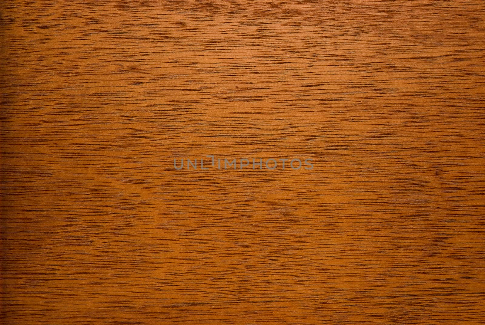close-up of fragment of wooden surface of brown color with visible texture, veins and unevenness