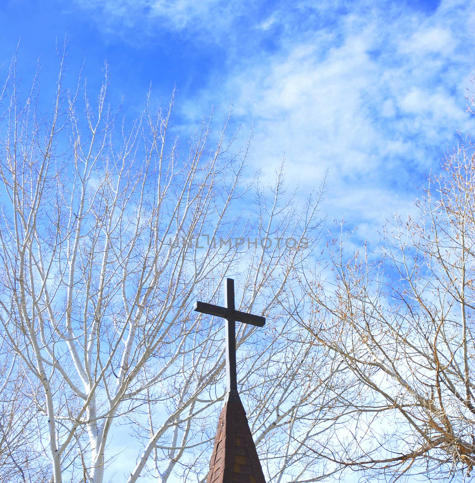 Church steeple against a clear blue sky.