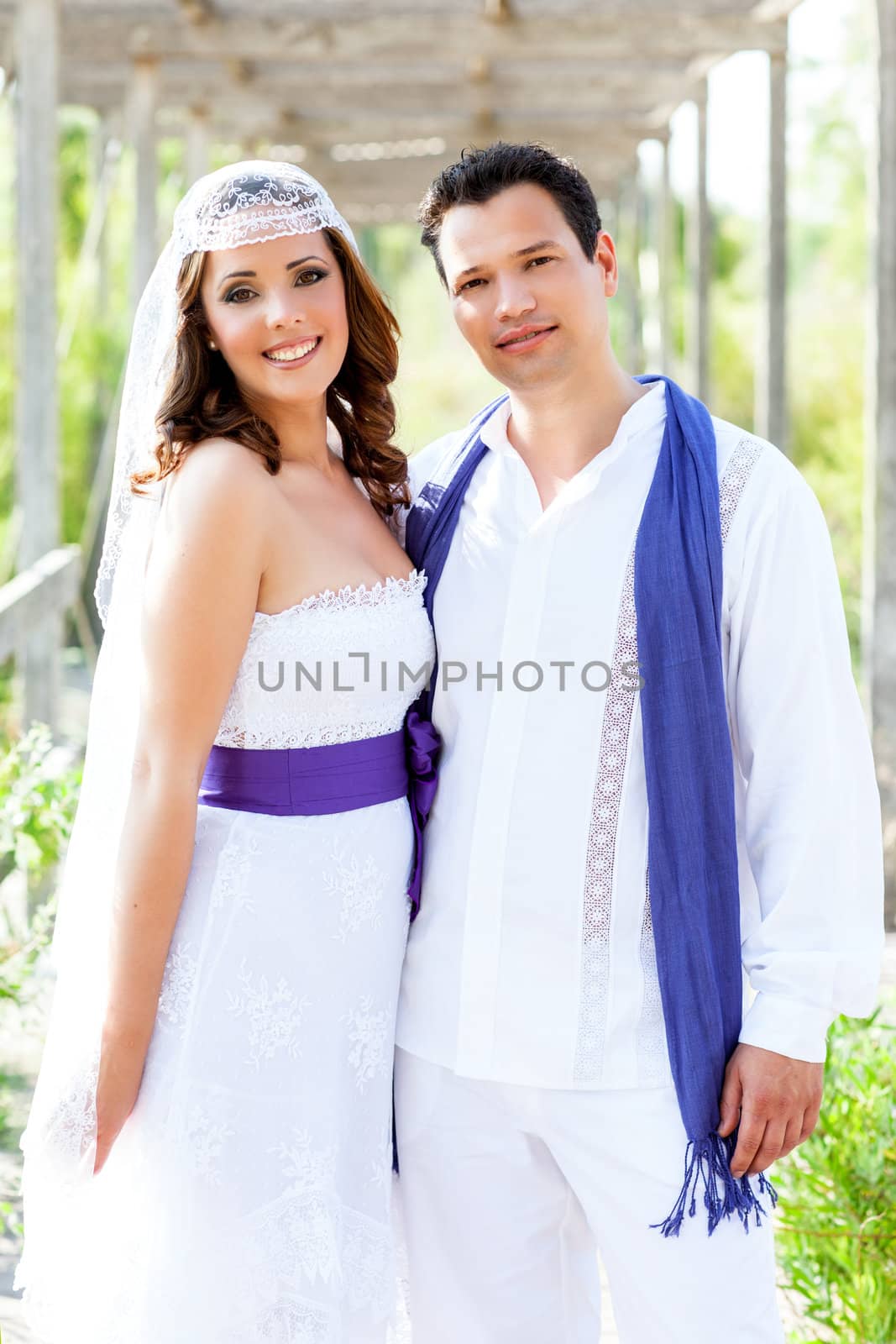 Couple happy hug in wedding day posing smiling in outdoor garden