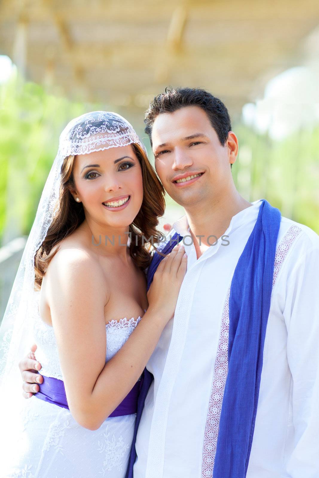 Couple happy hug in wedding day posing smiling in outdoor garden