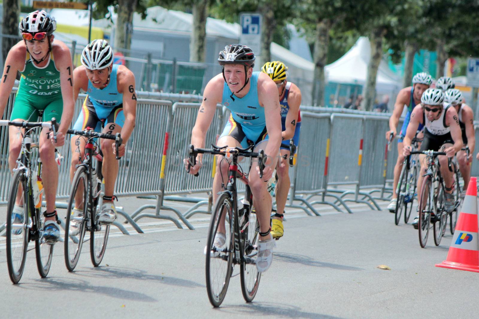 GENEVA, SWITZERLAND - JULY 22 : unidentified male cyclists at the International Geneva Triathlon, on July 22, 2012 in Geneva, Switzerland.