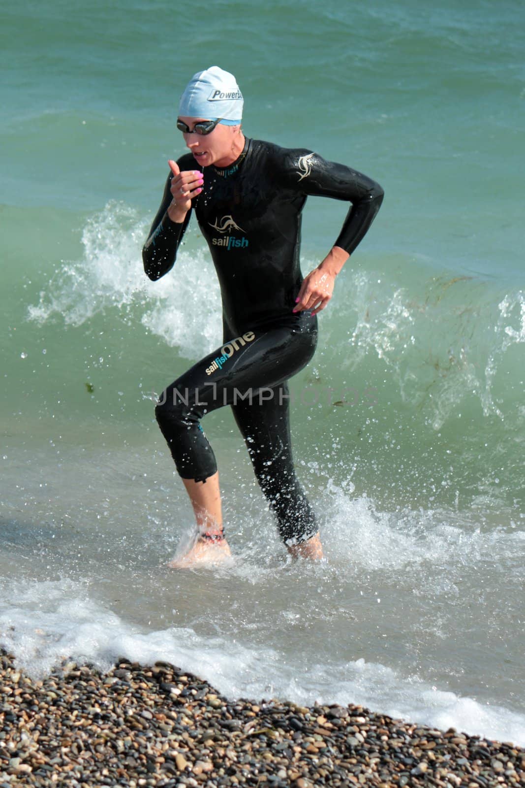 GENEVA, SWITZERLAND - JULY 22 : unidentified female athlet going out of water at the International Geneva Triathlon, on July 22, 2012 in Geneva, Switzerland.