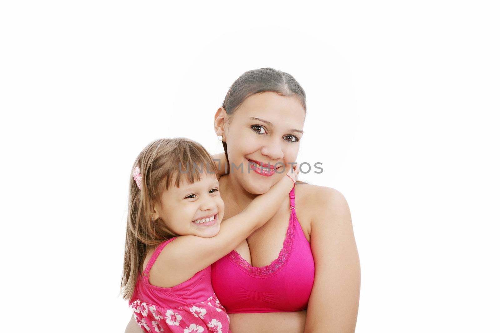 Portrait of Hispanic pregnant woman with daughter isolated over white background
