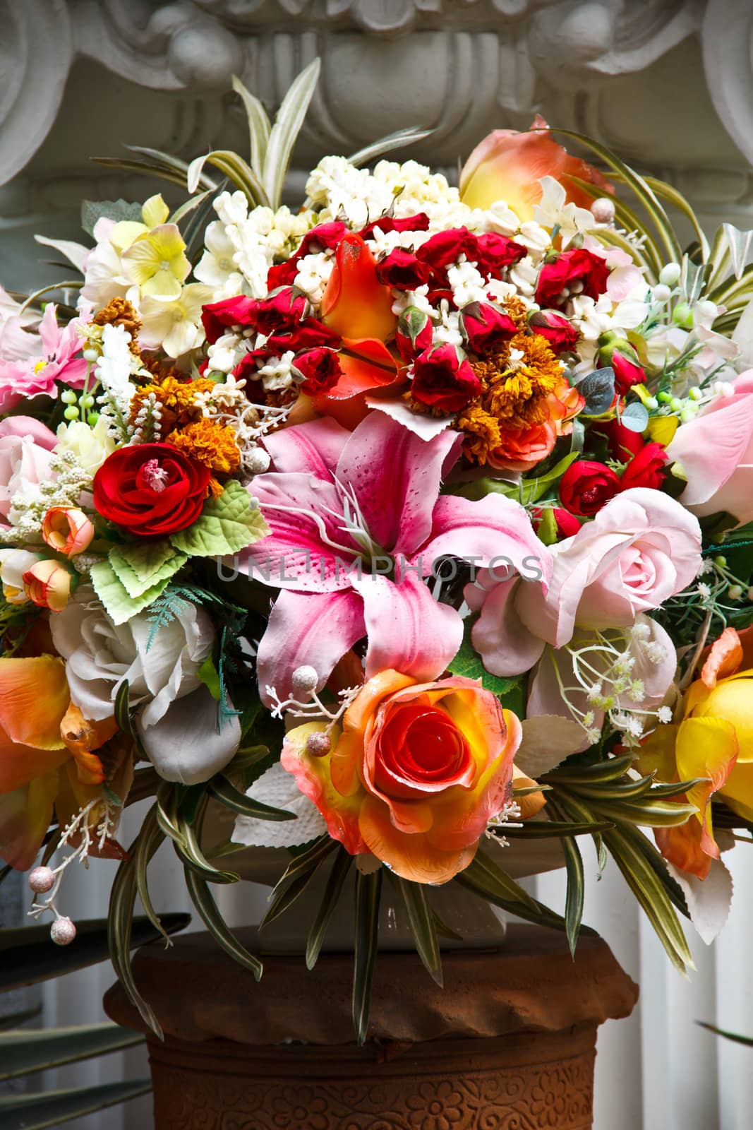 Bouquet of colorful flowers in the vase on the altar
