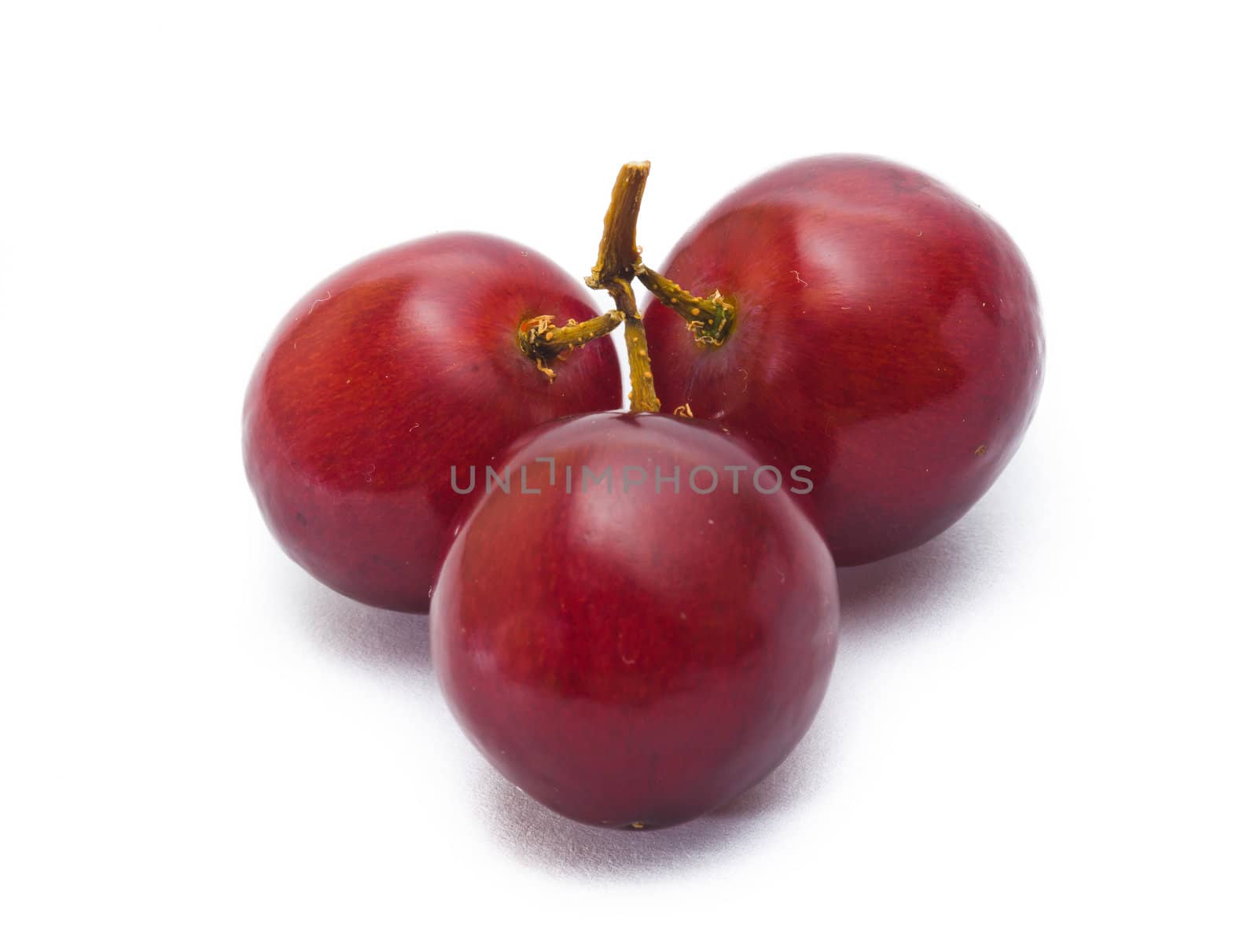 red grape isolated on white by heinteh