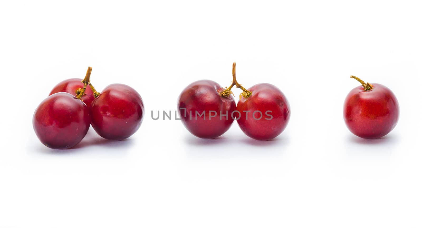 red grape isolated on white by heinteh