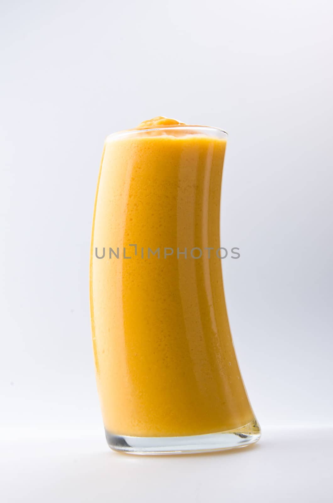 mango yogurt, milk shake isolated on white by heinteh