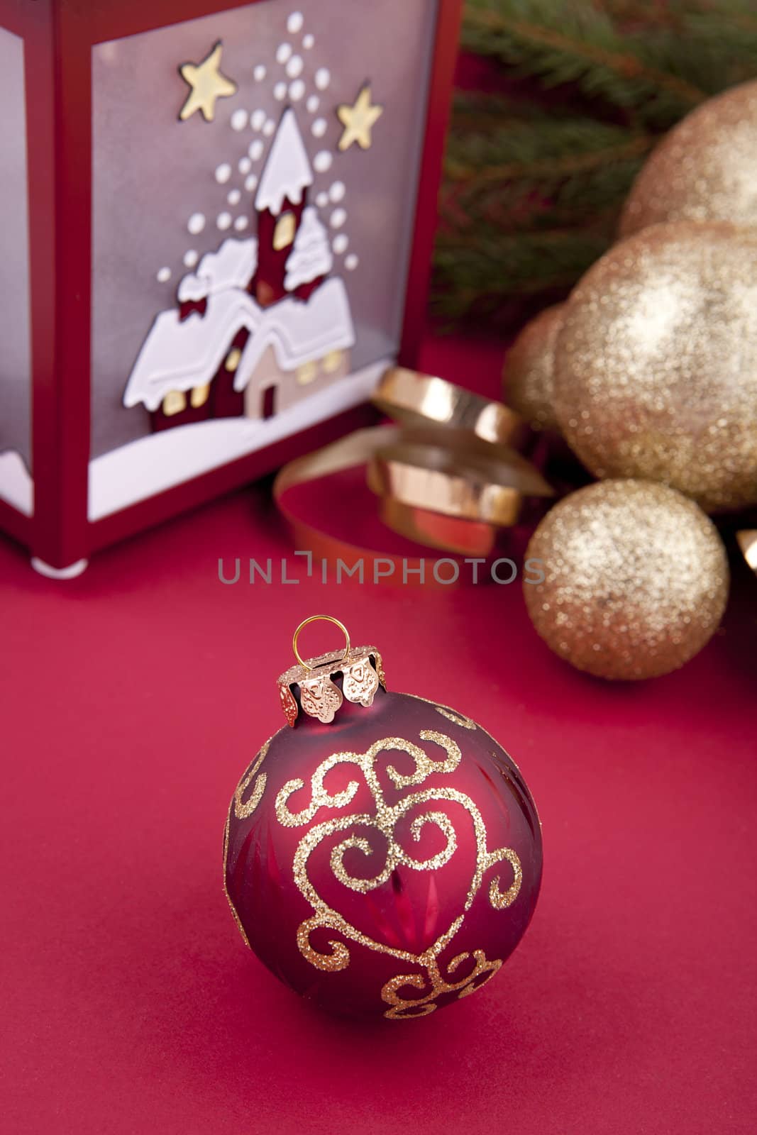 beautiful christmas decoration in gold and red color with tree and lamp