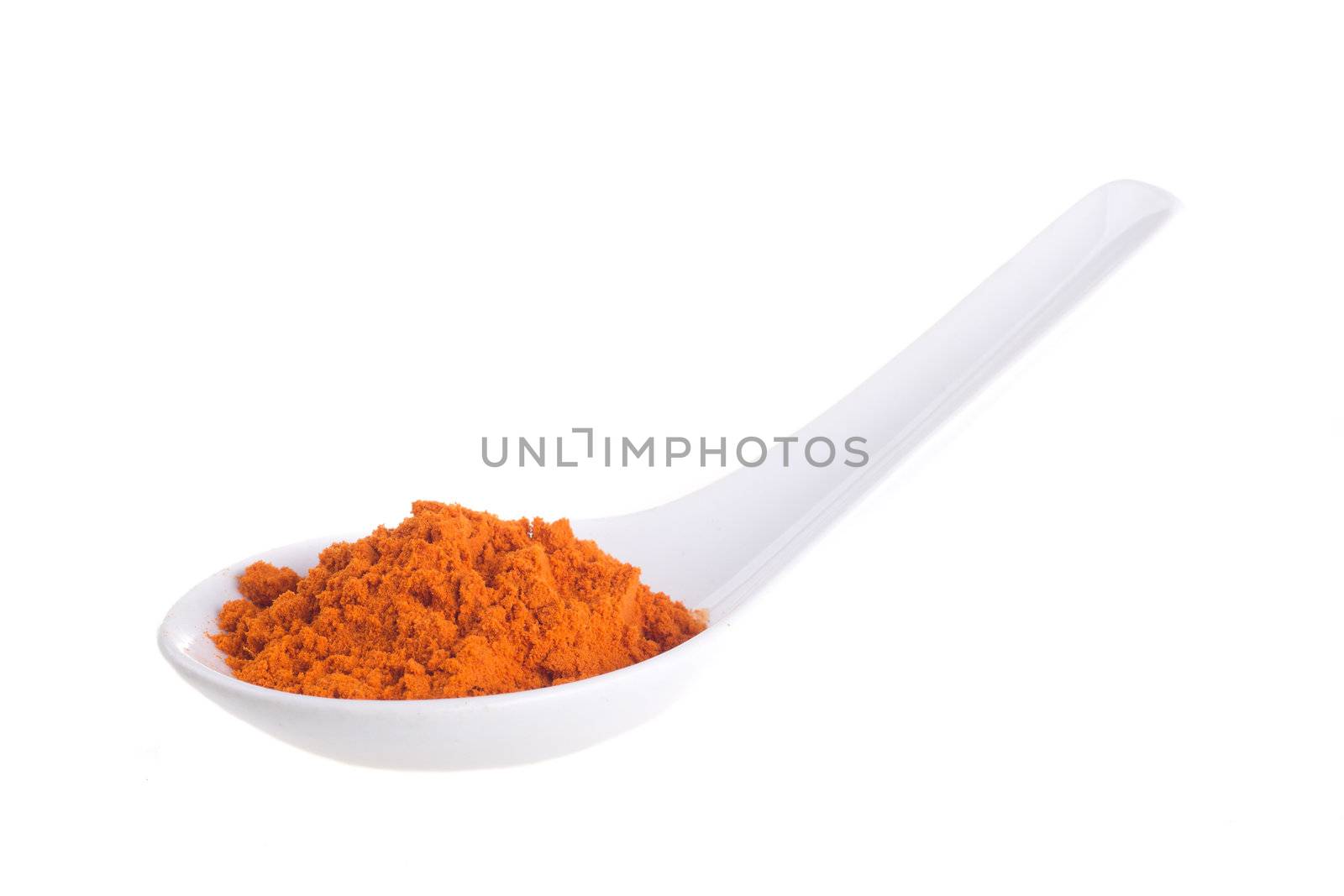 spices in the spoons on a white background