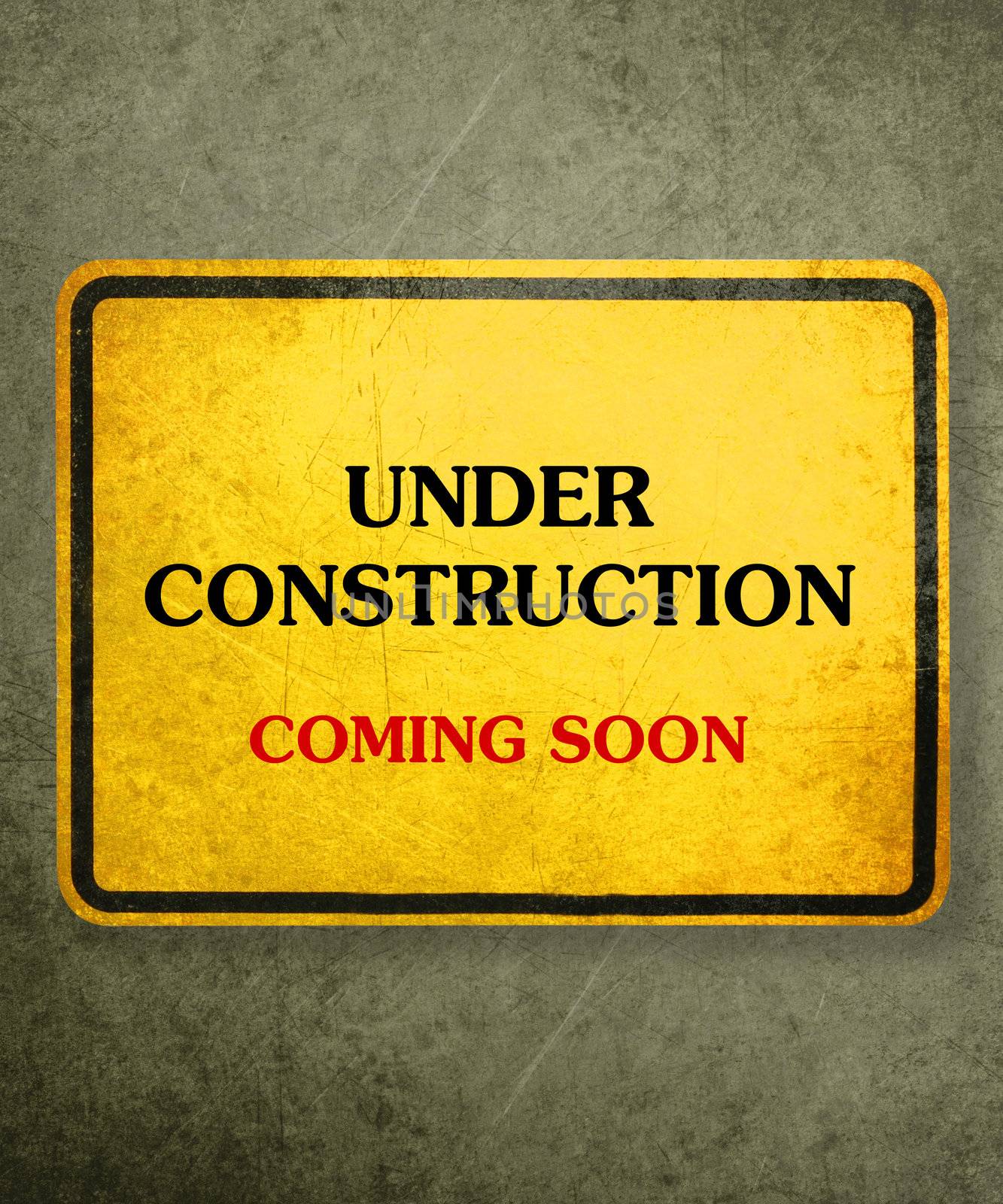 Alert yellow sign hanging on the wall, conceptual image for under construction and coming soon