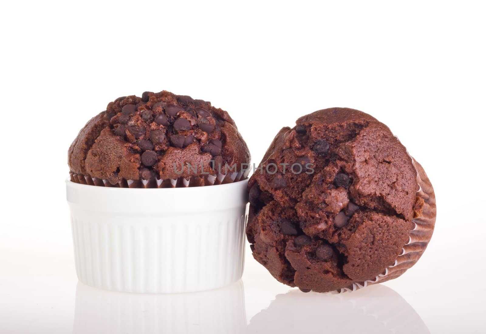 Chocolate muffin isolated on white background.